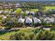 Aerial view of the community showcasing lush landscaping and golf course at 538 Fallbrook Dr, Venice, FL 34292