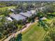 Aerial view of the neighborhood bordering the golf course at 538 Fallbrook Dr, Venice, FL 34292