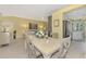 Dining room overlooking the living room and kitchen with large windows at 538 Fallbrook Dr, Venice, FL 34292