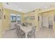 Bright dining room featuring a modern table set and a large window at 538 Fallbrook Dr, Venice, FL 34292