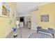 Inviting foyer with view into the living spaces, light wood floors and light yellow walls at 538 Fallbrook Dr, Venice, FL 34292