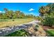 Manicured golf course view showcasing a lush fairway and mature trees at 538 Fallbrook Dr, Venice, FL 34292