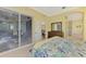 Well-lit main bedroom with access to the outdoor patio at 538 Fallbrook Dr, Venice, FL 34292