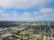 An aerial view displays the gorgeous neighborhood and town featuring many houses and bodies of water at 5419 1St W Ave, Bradenton, FL 34209