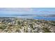 An aerial view showcases a beautiful waterfront neighborhood and town featuring many houses and bodies of water at 5419 1St W Ave, Bradenton, FL 34209