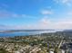 An aerial view displays the gorgeous waterfront neighborhood and town featuring many houses and bodies of water at 5419 1St W Ave, Bradenton, FL 34209