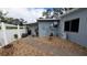 Backyard showcasing a stone walkway, gravel landscaping, and a storage shed at 5419 1St W Ave, Bradenton, FL 34209