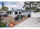 Backyard featuring gravel ground cover, stone pavers and outdoor patio at 5419 1St W Ave, Bradenton, FL 34209