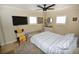 Bright bedroom with a ceiling fan, natural light, and a decorative rug at 5419 1St W Ave, Bradenton, FL 34209