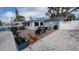 Inviting patio area with brick pavers, ample seating, and manicured landscaping, perfect for outdoor entertaining at 5419 1St W Ave, Bradenton, FL 34209