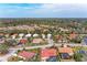 Aerial view of homes in the community with lush trees and greenery at 5513 83Rd E Ter, Sarasota, FL 34243