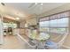 Cozy breakfast nook featuring tile flooring, an expansive window and views of the backyard at 5513 83Rd E Ter, Sarasota, FL 34243