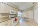 Bright eat-in kitchen features white cabinets, a breakfast table, and stainless steel appliances at 5513 83Rd E Ter, Sarasota, FL 34243