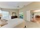 Comfortable bedroom featuring neutral carpet and views into the dining room at 5513 83Rd E Ter, Sarasota, FL 34243