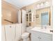 Accessible bathroom with a step-in tub, white vanity, and medicine cabinet at 5618 Monte Rosso Rd, Sarasota, FL 34243