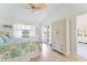 This bright, nicely decorated bedroom features wood-look floors, an exterior door and good closet space at 5618 Monte Rosso Rd, Sarasota, FL 34243