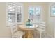 Cozy breakfast nook featuring shuttered windows providing natural light and comfortable seating at 5618 Monte Rosso Rd, Sarasota, FL 34243