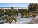 Inviting entrance to the beach featuring palm trees and walkway, a perfect blend of nature and accessibility at 5618 Monte Rosso Rd, Sarasota, FL 34243