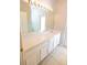 Bathroom featuring a large mirror, white cabinets, and a single sink vanity at 5638 Oakshire Ave, Sarasota, FL 34233