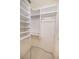 Walk-in closet with adjustable shelving and rods for flexible storage solutions at 5638 Oakshire Ave, Sarasota, FL 34233