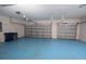 The large garage features an epoxy floor and two garage doors at 5638 Oakshire Ave, Sarasota, FL 34233