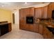 Spacious kitchen featuring wood cabinetry, granite countertops, and modern appliances at 5638 Oakshire Ave, Sarasota, FL 34233