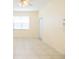 Bright living room with tile flooring, ceiling fan, and natural light from the window at 5638 Oakshire Ave, Sarasota, FL 34233