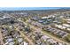 An aerial view showcases a home's location in a vibrant neighborhood near commercial buildings at 5724 25Th W St, Bradenton, FL 34207