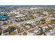 Scenic aerial view of a residential neighborhood, highlighting tree-lined streets and nearby businesses at 5724 25Th W St, Bradenton, FL 34207