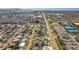 Expansive aerial shot capturing the neighborhood layout with nearby commercial and residential properties at 5724 25Th W St, Bradenton, FL 34207