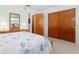 Bright bedroom showcasing a dresser, mirror, closet and a relaxed, inviting atmosphere at 5724 25Th W St, Bradenton, FL 34207