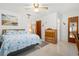 Relaxing bedroom boasts calming decor, natural light, and an adjacent bathroom at 5724 25Th W St, Bradenton, FL 34207