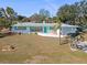 Inviting single-story home featuring a well-manicured lawn, turquoise trim, and attached garage at 5724 25Th W St, Bradenton, FL 34207