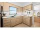 Well-lit kitchen featuring wood cabinetry, tiled backsplash, and stainless steel appliances at 5724 25Th W St, Bradenton, FL 34207