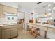 Bright kitchen features a breakfast bar with seating and views into the adjacent room at 5724 25Th W St, Bradenton, FL 34207