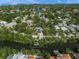 Stunning aerial view of the waterfront property surrounded by lush greenery and serene waterways at 615 Avenida Del Norte, Sarasota, FL 34242