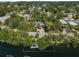 Beautiful waterfront property with lush landscaping and private boat dock access at 615 Avenida Del Norte, Sarasota, FL 34242