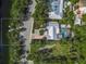 Detailed aerial perspective of the property's layout, including pool, landscaping, and proximity to the waterway at 615 Avenida Del Norte, Sarasota, FL 34242