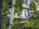 Aerial view of property featuring a pool, canal access and mature landscaping at 615 Avenida Del Norte, Sarasota, FL 34242