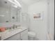 Modern bathroom features a quartz countertop, white cabinets, and a glass-enclosed shower at 615 Avenida Del Norte, Sarasota, FL 34242