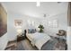 Cozy bedroom with plantation shutters, ensuite bath access and hardwood-style floors at 615 Avenida Del Norte, Sarasota, FL 34242