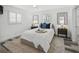 Bright bedroom with modern white shiplap walls, wood-look flooring, and stylish decor at 615 Avenida Del Norte, Sarasota, FL 34242