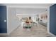 Open-concept living room with white shiplap walls and wood look tile flooring at 615 Avenida Del Norte, Sarasota, FL 34242