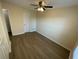 Bedroom with a door leading to the bathroom and hardwood floors at 6330 7Th W Ave, Bradenton, FL 34209