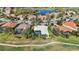 Aerial of home with a screened lanai and pool, situated on a golf course at 6626 The Masters Ave, Lakewood Ranch, FL 34202