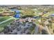 Aerial view showcasing the community clubhouse, golf course, and surrounding lakes at 6626 The Masters Ave, Lakewood Ranch, FL 34202