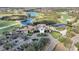 Aerial view of the clubhouse, parking and the golf course at 6626 The Masters Ave, Lakewood Ranch, FL 34202