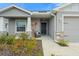 Charming front entrance with a welcoming door and landscaped garden at 6708 162Nd E Pl, Parrish, FL 34219