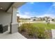 View from the front porch of a landscaped front yard and houses in the community at 6708 162Nd E Pl, Parrish, FL 34219