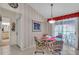 Inviting dining area with slider door access, adjacent to the updated kitchen space at 6713 Stone River Rd # 206, Bradenton, FL 34203